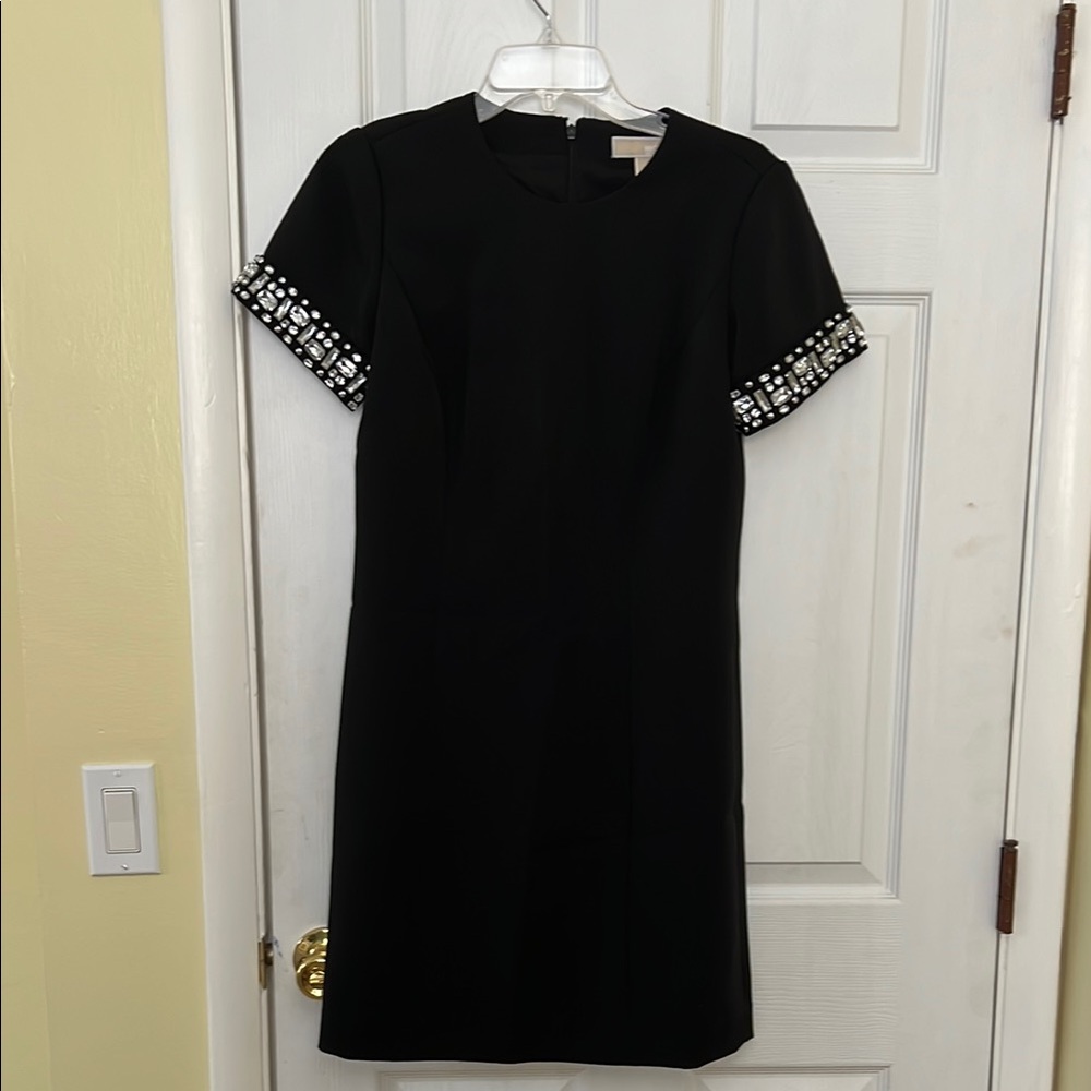 Elegant Black Dress with Embellished Sleeves